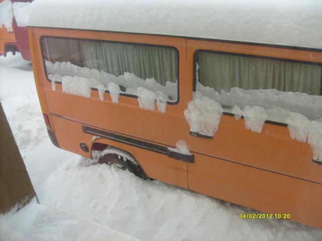 the bus blocked by snow